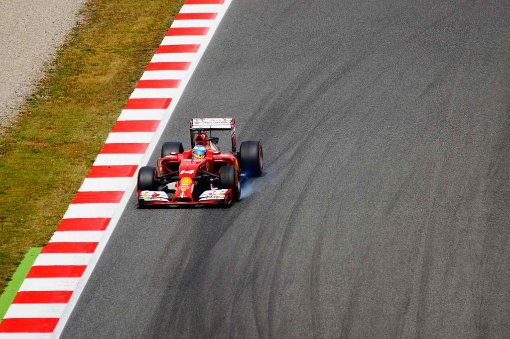 red car racing down track